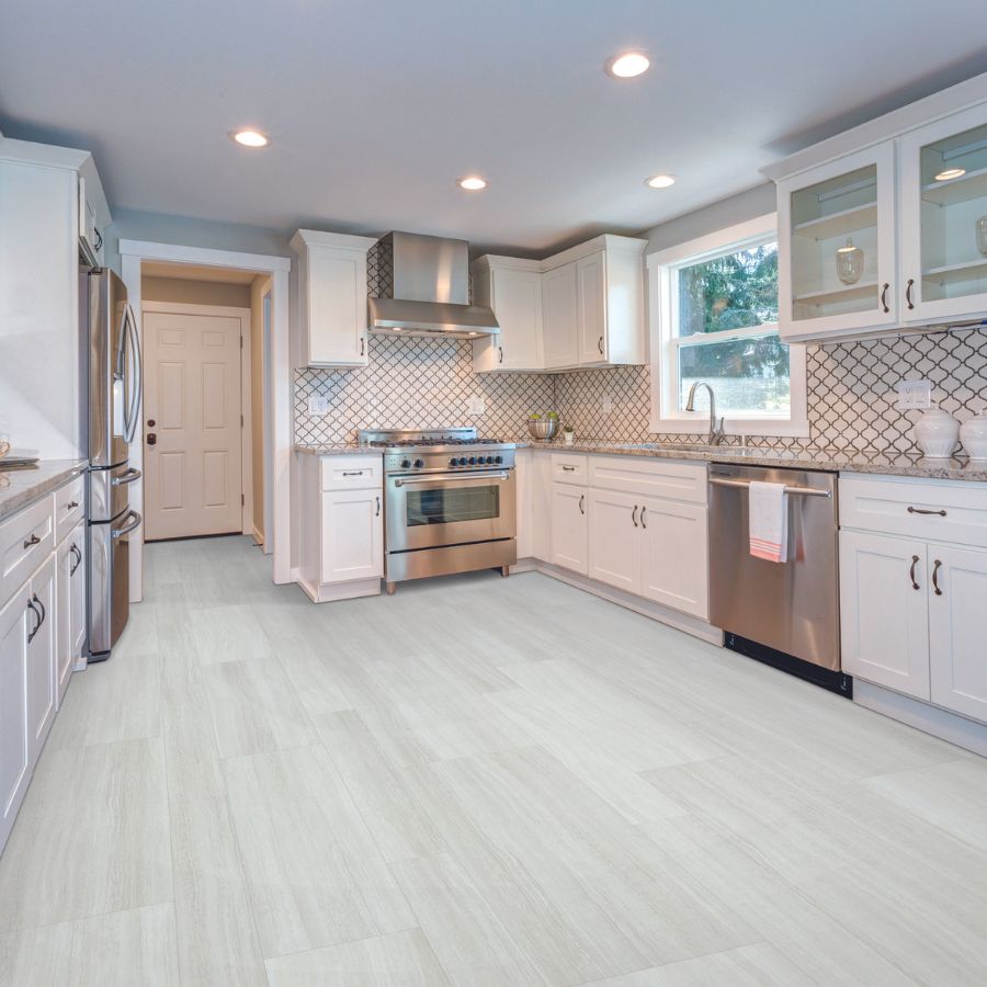stone countertops in a bright kitchen with white cabinets